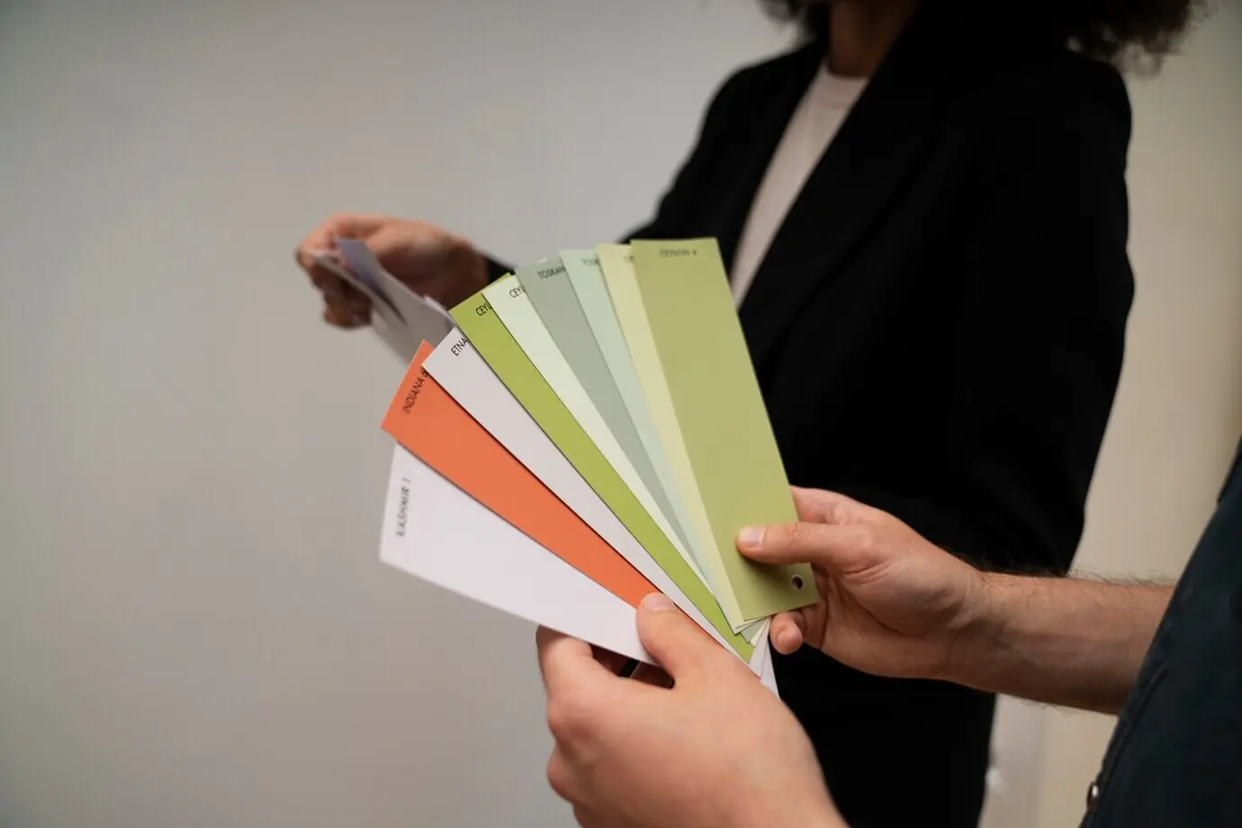 Side view of colleagues with a color palette